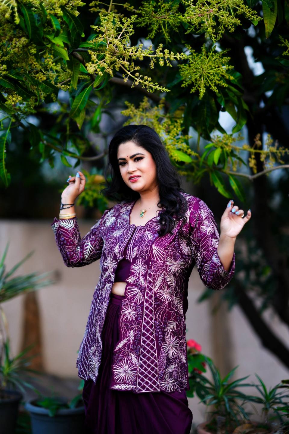 Traditional Half Saree Ceremony portrait of a young girl in elegant silk attire with floral decorations.